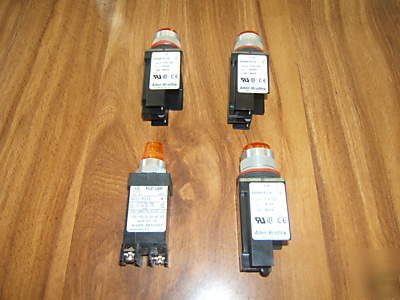 (4) allen-bradley [amber coloerd] pilot lights.